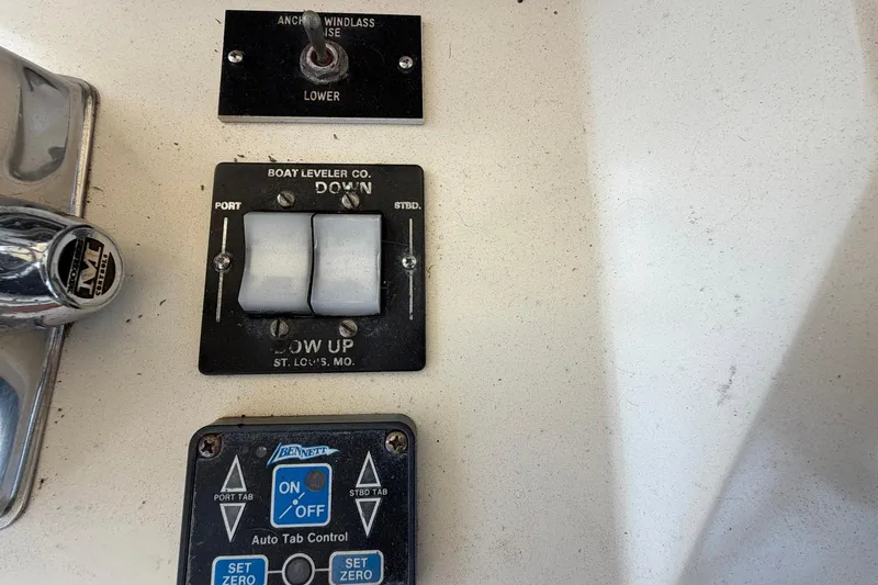 Slide: The Image of Control panel of a 1987 Viking 44 Motor Yacht with switches and buttons. - 71