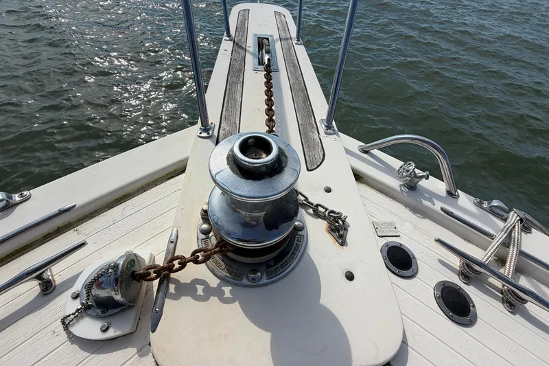 Slide: The Image of Anchor winch on 1987 Viking 44 Motor Yacht deck, with ocean view. - 8