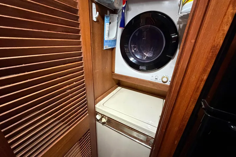 Slide: The Image of Laundry area in 1987 Viking 44 Motor Yacht with washer and dryer. - 88