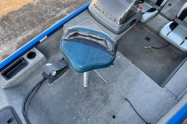 Slide: The Image of 2008 Triton TC-17 boat interior with blue seat and control panel. - 12