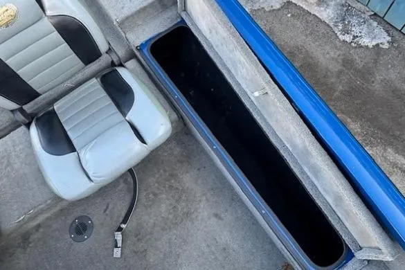 Slide: The Image of 2008 Triton TC-17 boat interior with storage compartment and seat. - 15