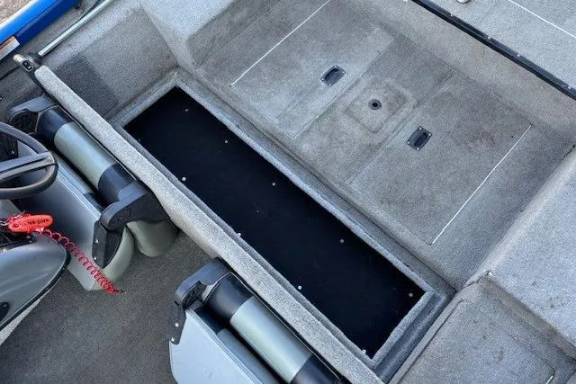 Slide: The Image of 2008 Triton TC-17 boat interior with storage compartments and seating. - 19