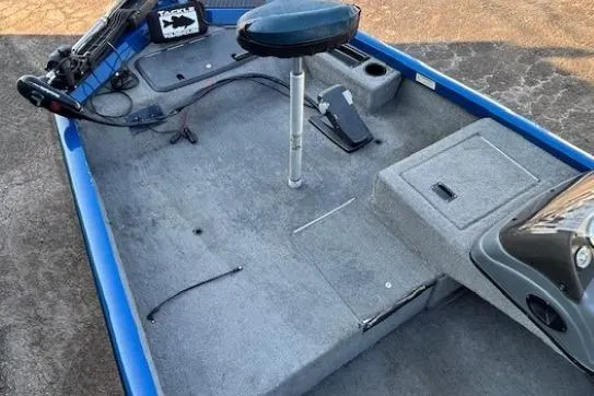 Slide: The Image of 2008 Triton TC-17 boat interior with blue trim and fishing seat. - 7