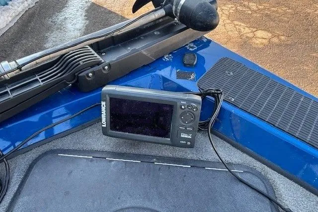 Slide: The Image of Fishfinder on 2008 Triton TC-17 boat, featuring Lowrance display and blue deck. - 9