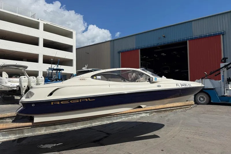 Slide: The Image of 1999 Regal 1900 LSR boat on trailer outside storage facility. - 25