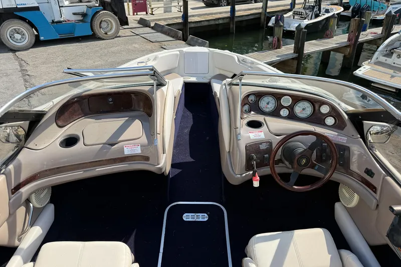 Slide: The Image of Interior of a 1999 Regal 1900 LSR boat with dashboard and steering wheel. - 3