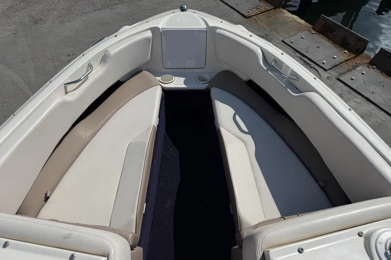 Slide: The Image of 1999 Regal 1900 LSR boat interior with beige seating and cup holders. - 5