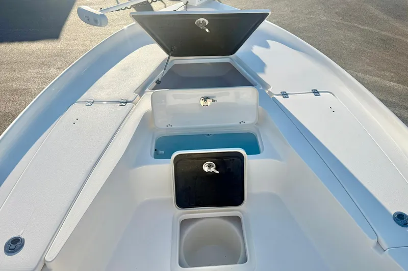 Slide: The Image of 2020 Key West 230 Bay Reef boat with open storage compartments. - 15