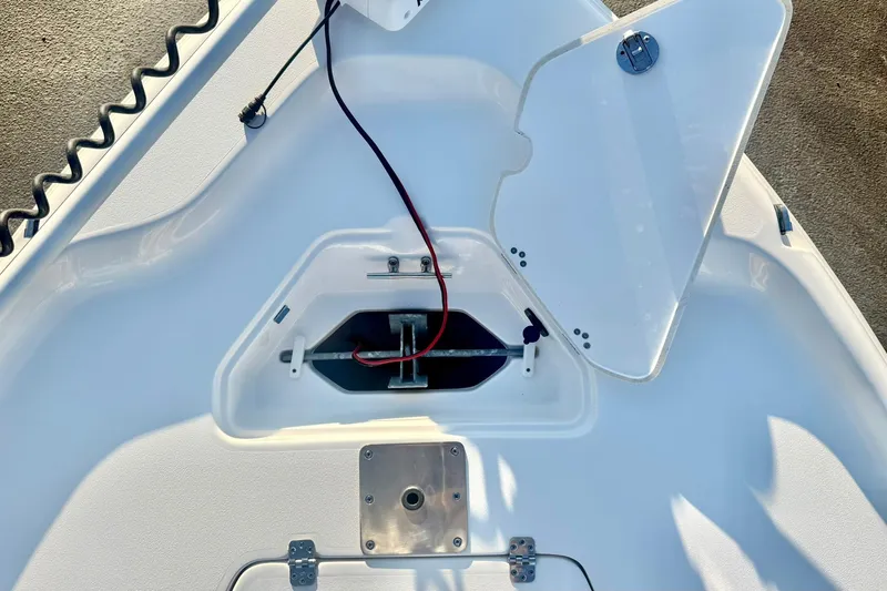 Slide: The Image of 2020 Key West 230 Bay Reef boat anchor compartment with open hatch and wiring. - 19