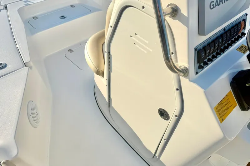 Slide: The Image of 2020 Key West 230 Bay Reef boat interior with control panel and seating. - 27