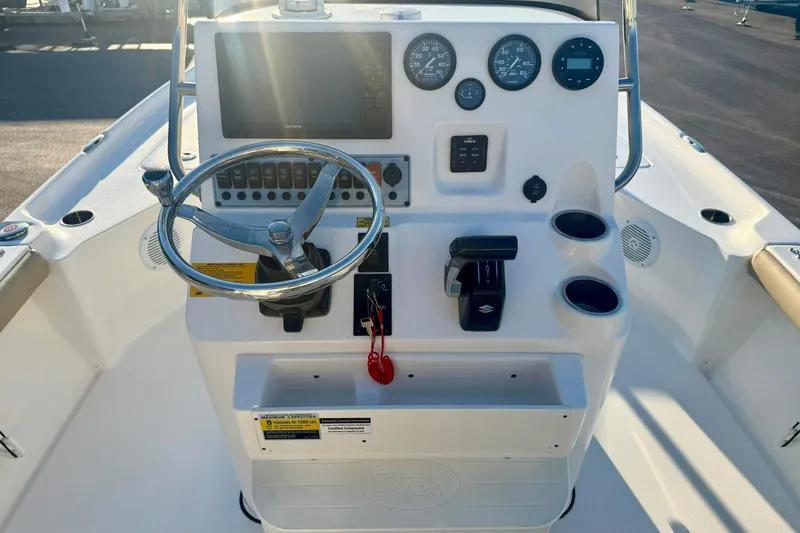 Slide: The Image of 2020 Key West 230 Bay Reef boat console with steering wheel and gauges. - 3