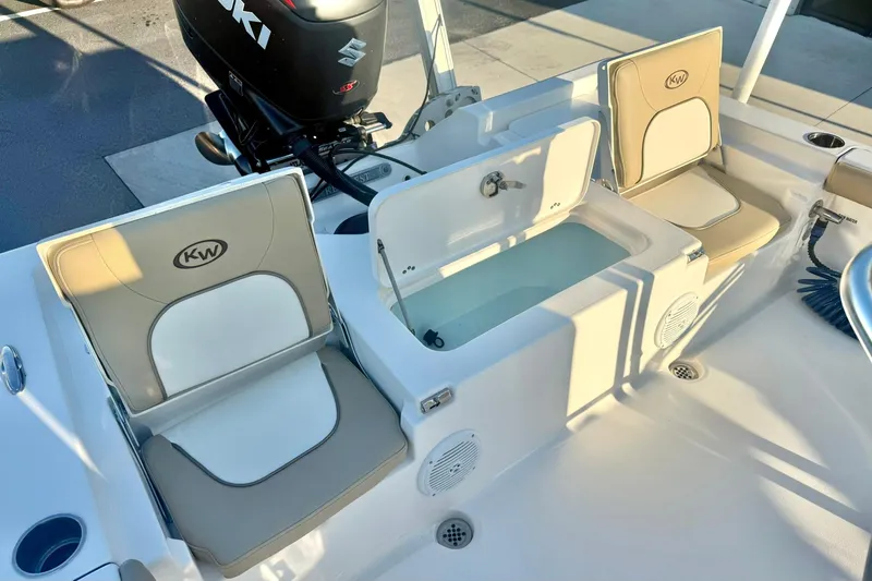 Slide: The Image of 2020 Key West 230 Bay Reef boat interior with seating and storage compartments. - 35