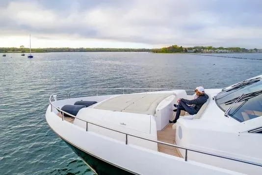 Slide: The Image of Luxurious 2013 Sunseeker Manhattan 73 yacht cruising on open water. - 1