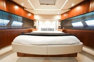 Slide: The Image of Luxurious bedroom interior of 2013 Sunseeker Manhattan 73 yacht with elegant wood paneling. - 20