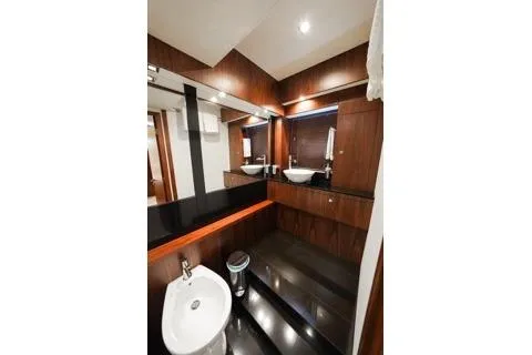 Slide: The Image of Luxurious bedroom interior of 2013 Sunseeker Manhattan 73 yacht with elegant wood finishes. - 22