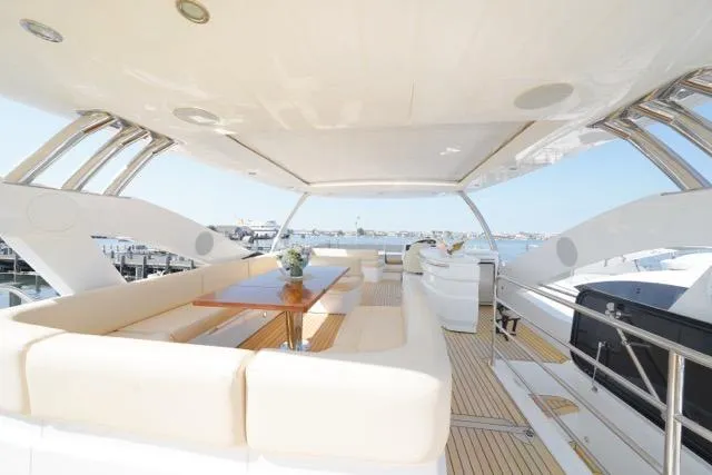 Slide: The Image of Luxurious 2013 Sunseeker Manhattan 73 yacht with spacious outdoor seating and elegant design. - 6