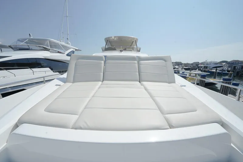 Slide: The Image of Luxurious 2013 Sunseeker Manhattan 73 yacht with sleek white exterior and spacious deck seating. - 9