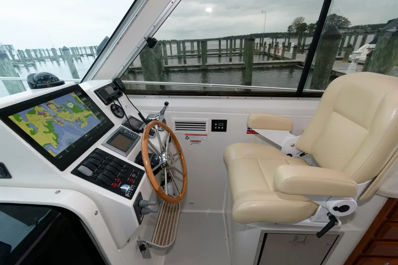 Slide: The Image of Helm of 2010 Back Cove 33 boat with navigation system and captain's chair. - 16