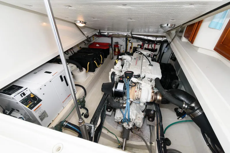 Slide: The Image of Engine room of 2010 Back Cove 33 boat, featuring mechanical components and equipment. - 25