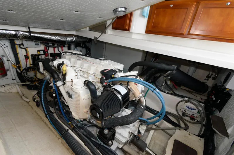 Slide: The Image of Engine room of 2010 Back Cove 33 boat, showcasing detailed mechanical components. - 26