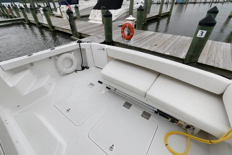 Slide: The Image of Back Cove 33 boat deck, 2010 model, with seating and dock view. - 8
