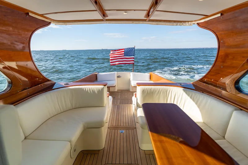 Slide: The Image of Hinckley Talaria 44 MKII Express yacht interior with ocean view and American flag, 2010 model. - 10