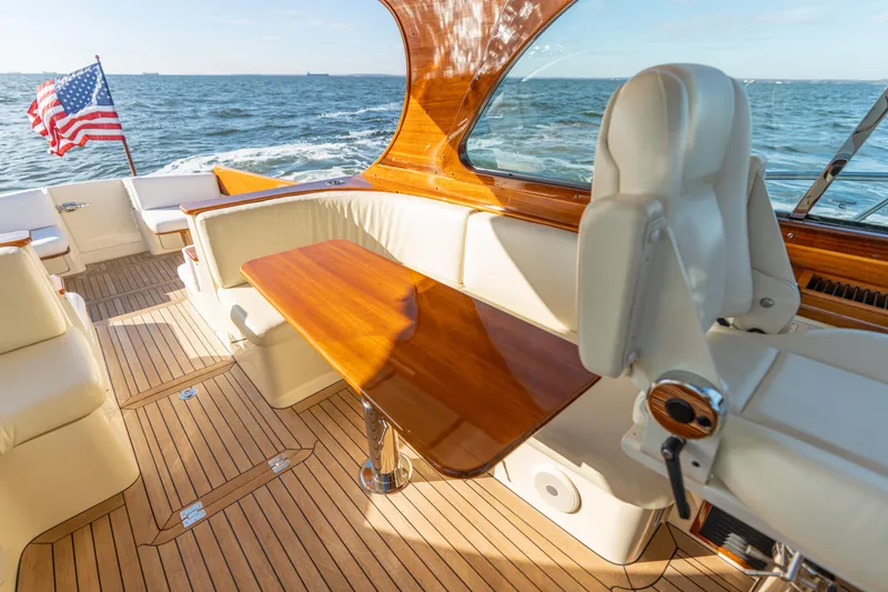 Slide: The Image of Luxurious 2010 Hinckley Talaria 44 MKII Express yacht interior with elegant wood finish and ocean view. - 23