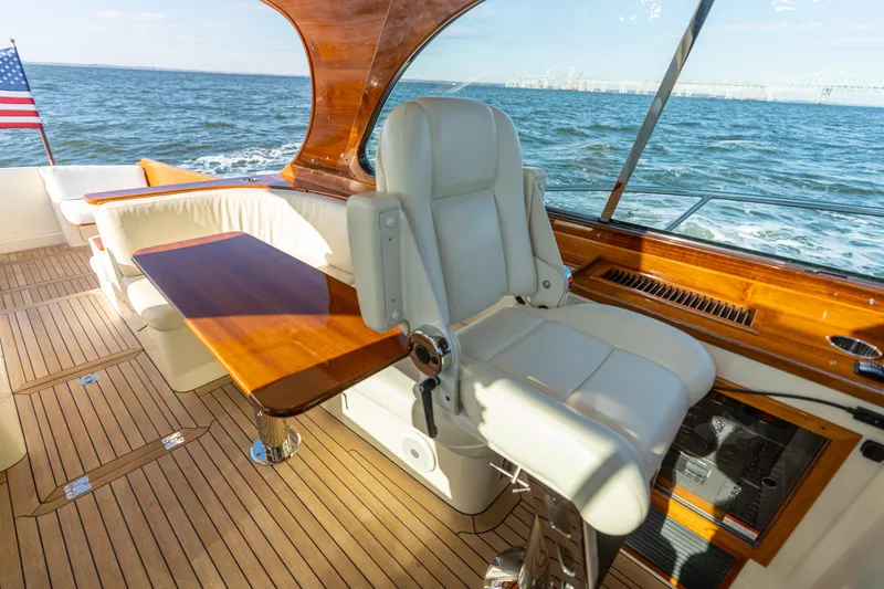 Slide: The Image of Luxurious 2010 Hinckley Talaria 44 MKII Express yacht interior with leather seating and wooden accents. - 25