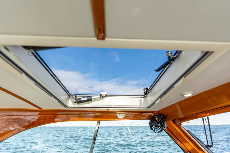 Slide: The Image of Interior view of 2010 Hinckley Talaria 44 MKII Express yacht with skylight and ocean backdrop. - 26