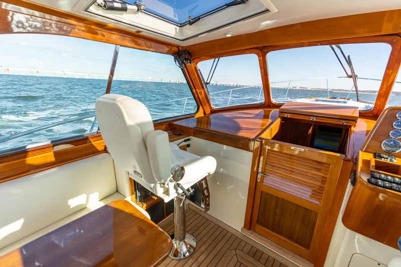 Slide: The Image of Interior of 2010 Hinckley Talaria 44 MKII Express yacht with wooden finishes and ocean view. - 27