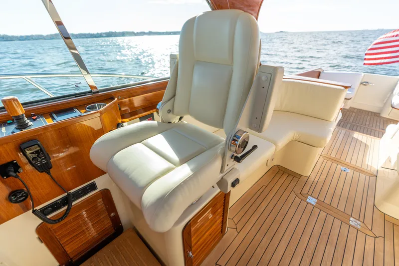 Slide: The Image of Luxury helm seat on 2010 Hinckley Talaria 44 MKII Express yacht, overlooking ocean. - 28