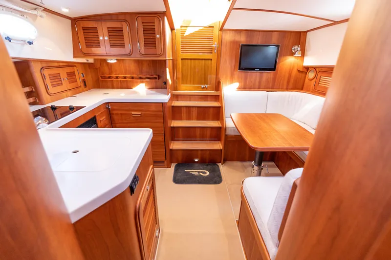 Slide: The Image of Luxurious interior of 2010 Hinckley Talaria 44 MKII Express yacht with wood finish. - 32