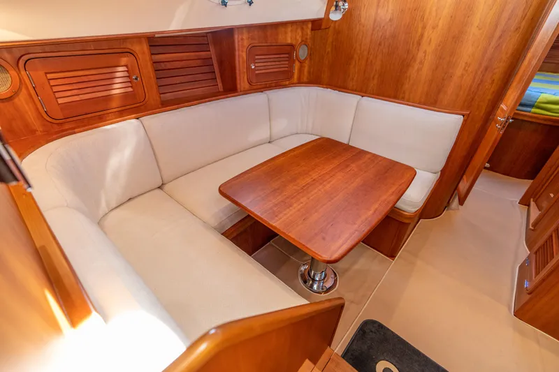 Slide: The Image of Luxurious interior of 2010 Hinckley Talaria 44 MKII Express with elegant wood finish and cozy seating. - 33