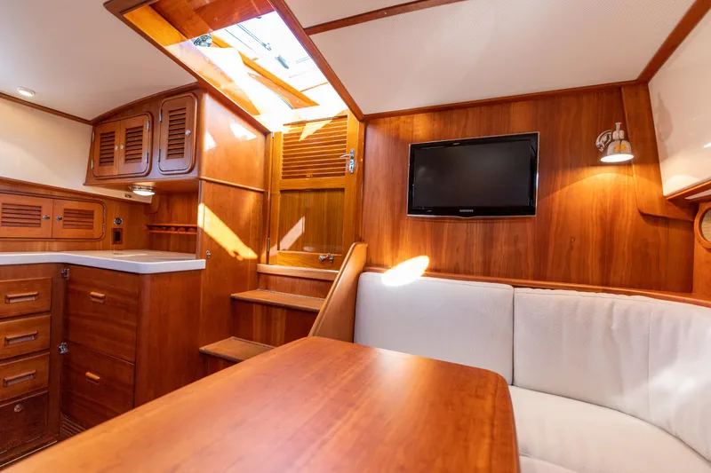 Slide: The Image of Interior of 2010 Hinckley Talaria 44 MKII Express yacht with wood finish and seating area. - 38