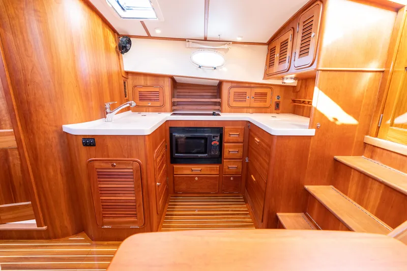 Slide: The Image of Luxurious wooden interior of 2010 Hinckley Talaria 44 MKII Express yacht kitchen. - 39