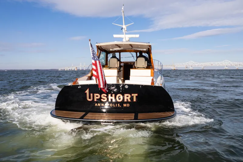 Slide: The Image of Hinckley Talaria 44 MKII Express yacht cruising on open water, rear view, 2010 model. - 6