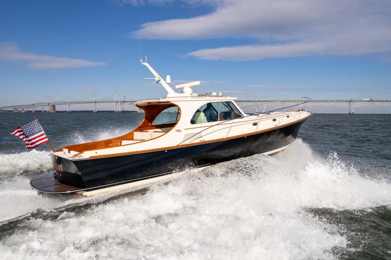 Slide: The Image of 2010 Hinckley Talaria 44 MKII Express cruising on open water. - 7