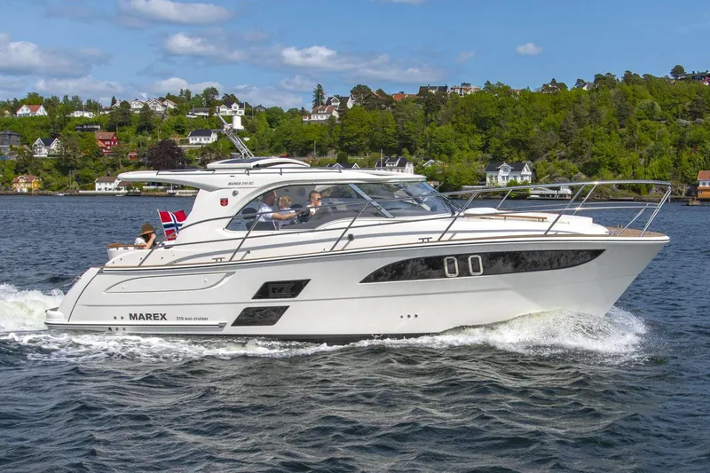 The Image of Manufacturer Provided Image: 2026 Marex 310 Sun Cruiser on a serene lake. - 0