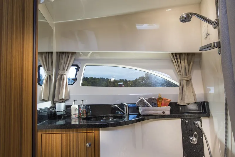 Slide: The Image of Manufacturer Provided Image: Interior of 2026 Marex 310 Sun Cruiser with modern amenities. - 10