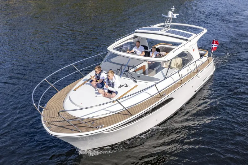 Slide: The Image of Manufacturer Provided Image: 2026 Marex 310 Sun Cruiser on water, elegant white yacht. - 2