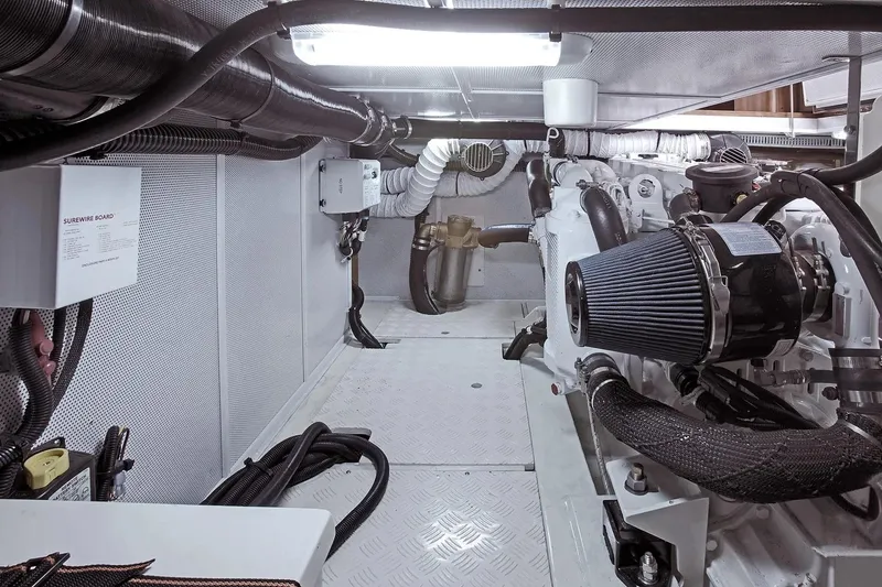 Slide: The Image of Engine room of 2025 Helmsman Trawlers 38 Sedan, showcasing modern marine equipment. - 27