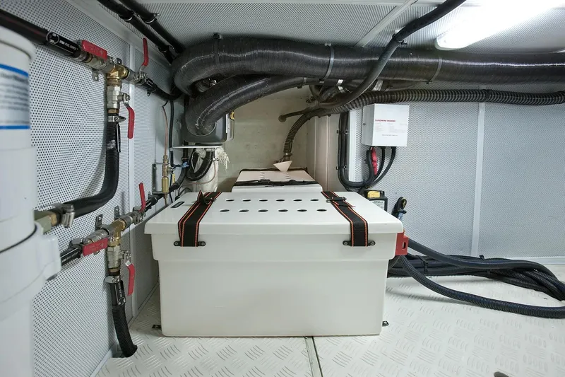 Slide: The Image of Engine room of 2025 Helmsman Trawlers 38 Sedan with pipes and equipment. - 28