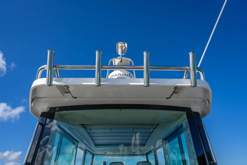 Slide: The Image of Axopar 37 XC Cross Cabin 2017 boat with Garmin equipment against blue sky. - 23