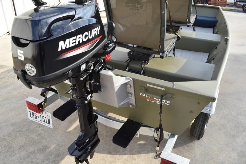 Slide: The Image of 2024 Lowe L1040 Jon boat with Mercury 5HP outboard motor on trailer. - 5