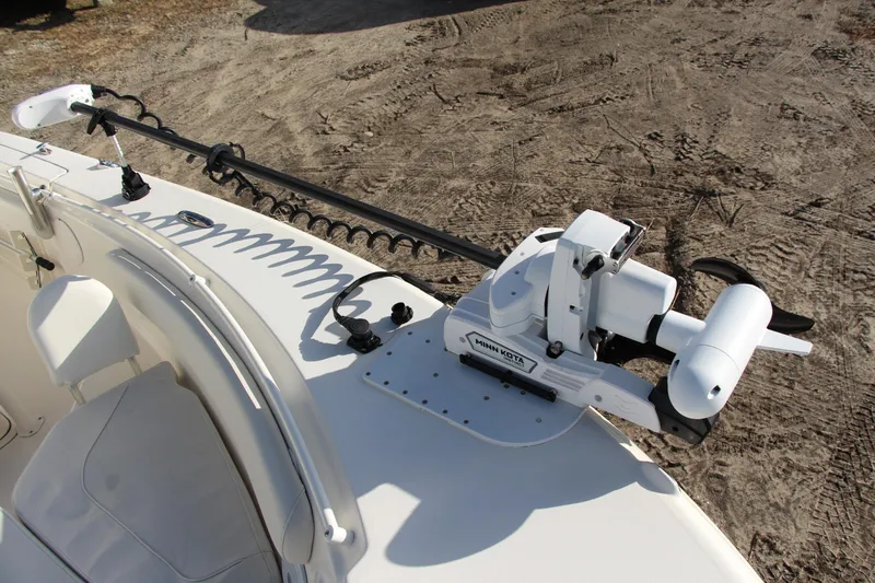 Slide: The Image of 2024 Key West 244 Center Console boat with Minn Kota trolling motor on deck. - 10