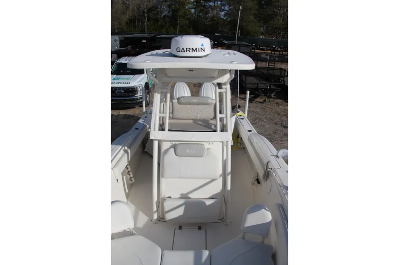 Slide: The Image of 2024 Key West 244 Center Console boat with Garmin equipment, featuring spacious seating and modern design. - 12
