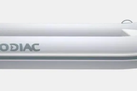 The Image of 2024 Zodiac Nomad 2.7 RIB Alu inflatable boat, side view, white with logo. - 1