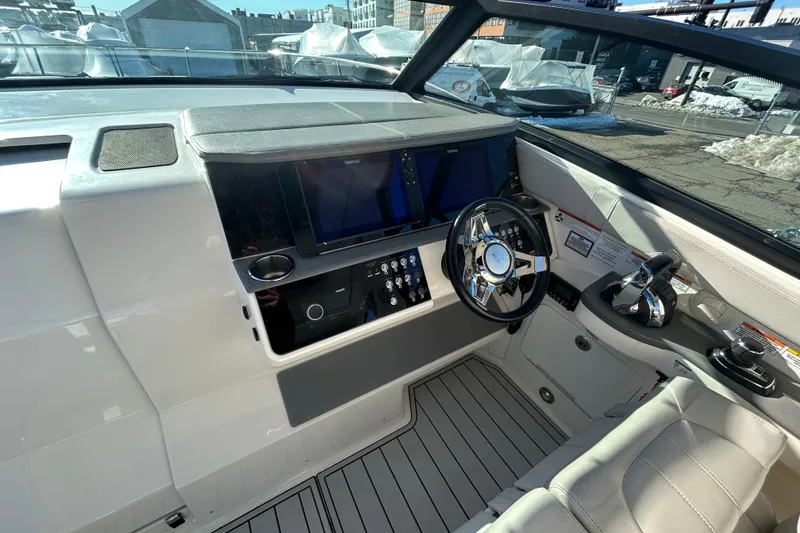 Slide: The Image of 2021 Sea Ray Sundancer 320 helm with modern controls and sleek design. - 6