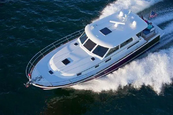 Slide: The Image of Sabre 45 Salon Express 2027 cruising swiftly on the water. - 1