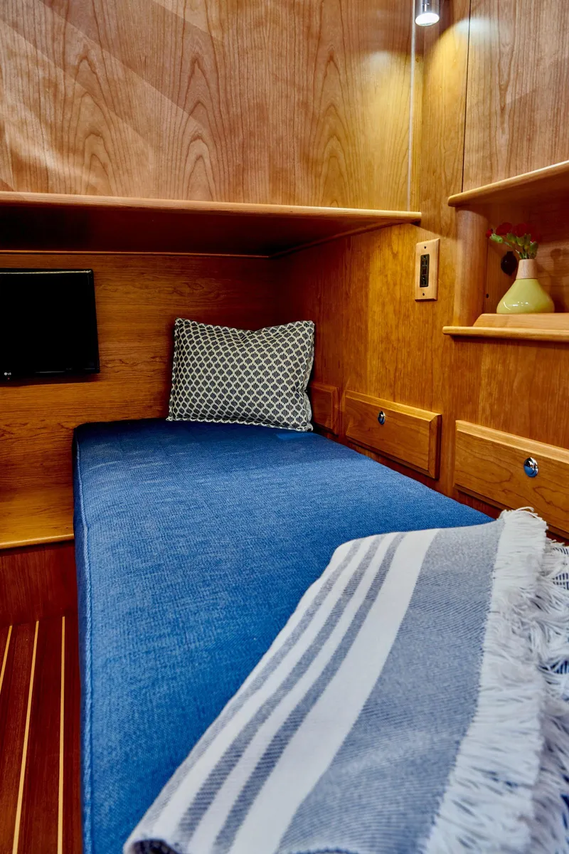 Slide: The Image of Interior of Sabre 45 Salon Express 2027 with cozy bed. - 16